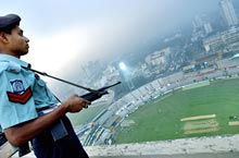 A Bangladeshi policeman stands guard over the Bangabandhu National Stadium in Dhaka as the Indian team practice on Thursday (Dec 9, 2004).