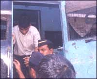 Mohammad Afroz Abdul Razak alighting from a police van. Pic: Jewella C Miranda