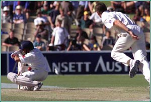 Sachin ducks into a McGrath bouncer