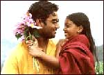 A still from Kannathil Muthamittal -- Madhavan and Keerthana