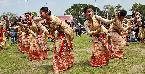 Youth in traditional Assamese attire perform Bihu dance during a programme organised to celebrate Rongali Bihu, at Judge's Field in Guwahati