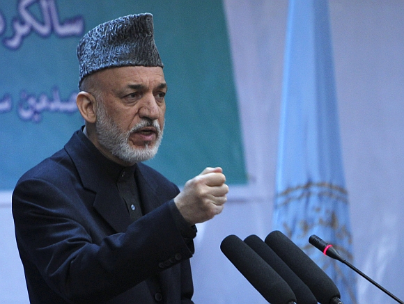Afghan President Hamid Karzai speaks during a gathering in Kabul
