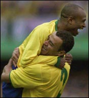 Edilson (top) with teammate Cafu 