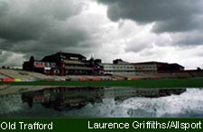 The rain-soaked outfield at Old Trafford, Manchester